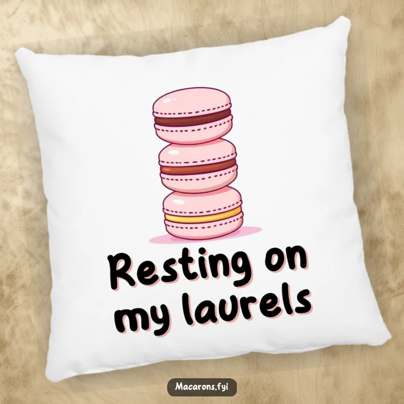 Funny pillow design of a triumphant macaron standing atop a stack of three smaller macarons, representing sweet accomplishment and pride.