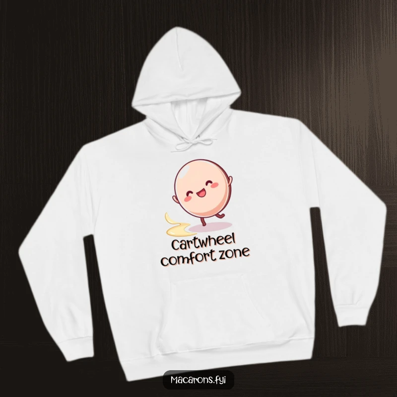 Soft hoodie featuring a funny macaron character performing a happy cartwheel with a signature swirl of cream.