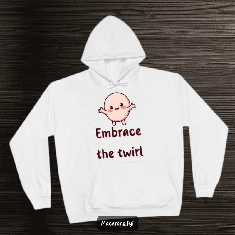 Funny macaron hoodie showcasing a blushing macaron character happily spinning with arms wide, embodying pure joy.